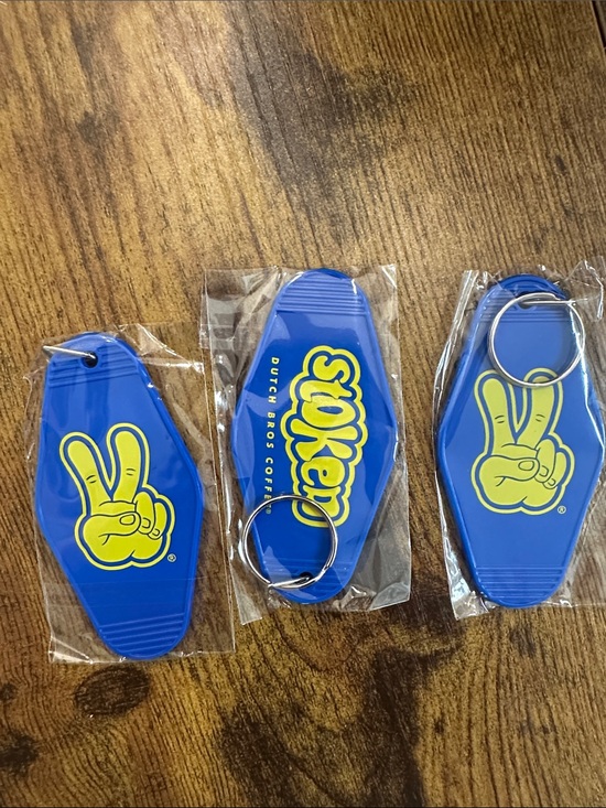 Dutch Bros Other - Dutch Bros Blue Stoken Keychains with Yellow Peace-Hand Logo